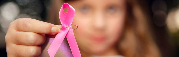 a girl with a breast cancer ribbon