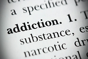 zoomed in page of the addiction dictionary page in black and white