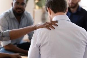 People Helping Man at Rehab Center to know Why Should Drug Addicts Go To Rehab Instead Of Jail