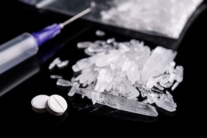 heavy drug methamphetamine crystal isoalted on a black background looking at how addictive is methamphetamine