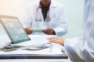 medicine doctors working with computer notebook at desk in the hospital
