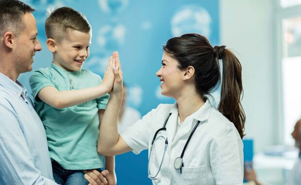 nurse giving a child a high five