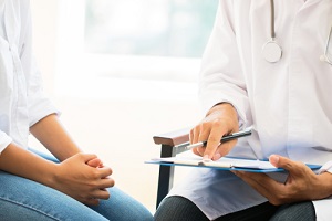 woman patient having consultation with doctor about Outpatient Program 