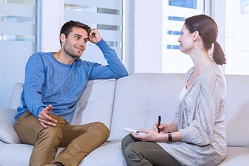 a man in addiction recovery receiving individual therapy treatment