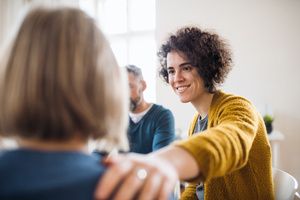 A woman is encouraging new joinee