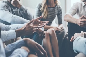 people talking during group therapy session