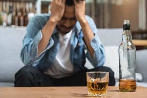 upset man with alcohol