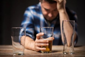 alcohol addict man drinking alcohol from glass
