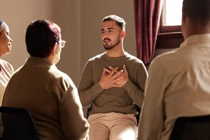 alcohol addicted man in therapy session
