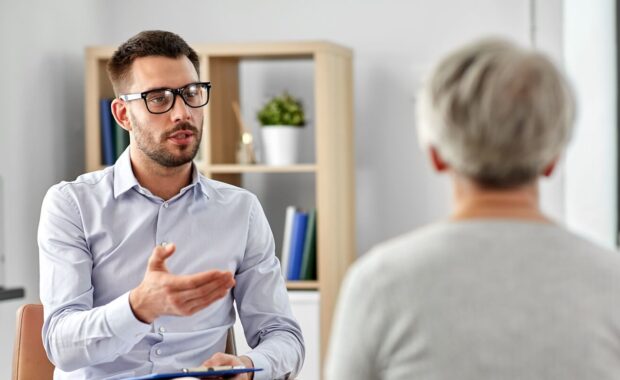 Northern VA psychologist talking to senior woman patient at psychotherapy session