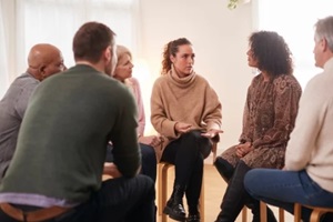  DC woman speaking at support group meeting for mental health