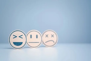 wooden labels with happy normal and sad face icons for experience survey services and products review concept
