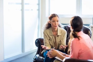 psychologist having session with her patient in office