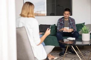 man crying during CBT therapy program