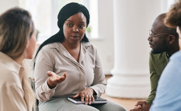 DC psychotherapist giving advice to intensive outpatient program patients during session