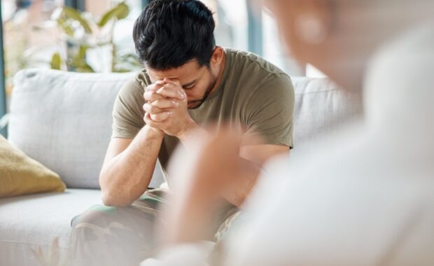 male soldier in therapy for mental health, depression or grief after a military war