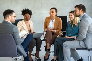 people in group therapy having an interesting discussion