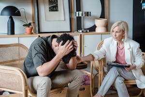 Therapist Supporting A Man During Therapy