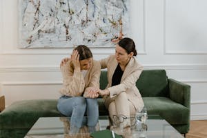 Woman Showing Compassion to Girl During Therapy