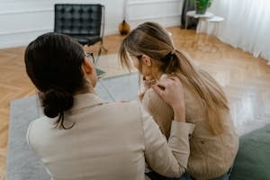 Therapist Comforting a Woman in Therapy Session