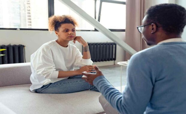 Woman Listening to Therapist in Indivisual Therapy-session