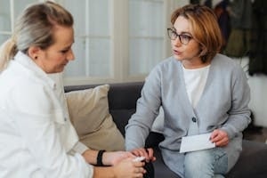 Woman Therapist Encouraging Another Woman