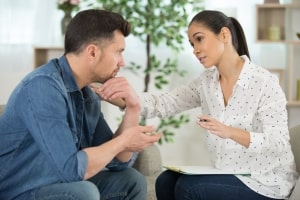 Therapist Talking to Upset Man During Indivisual Therapy
