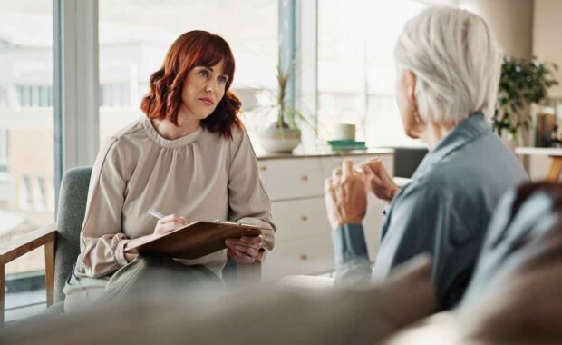 Psychologist Talking to Senior Woman for Mental Health Assessment