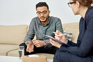 Therapist Talking to Upset Man During Indivisual Therapy