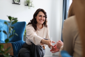Female Therapist Engaging with Patient in Cozy Office Setting