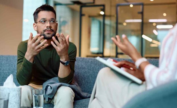 Sad Man Explaining His Problems to Therapist in Indivisual Therapy