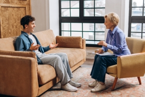 Teenage Boy Happy in Front of A Therapist