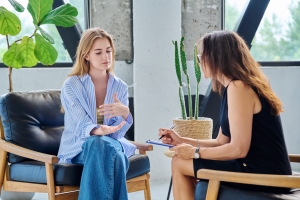 Young Woman Talking to Therapist About Mental Health Issues