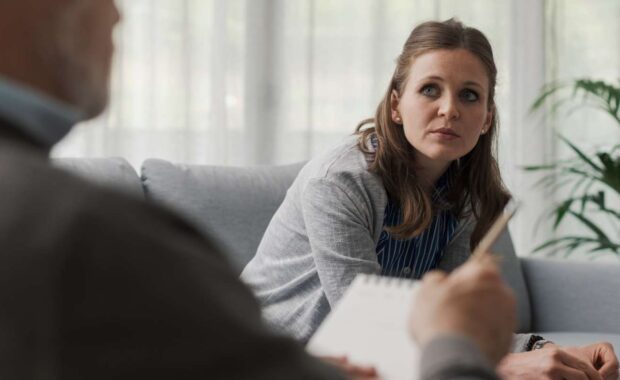 Depressed Woman Talking to Therapist in Indivisual Therapy Session
