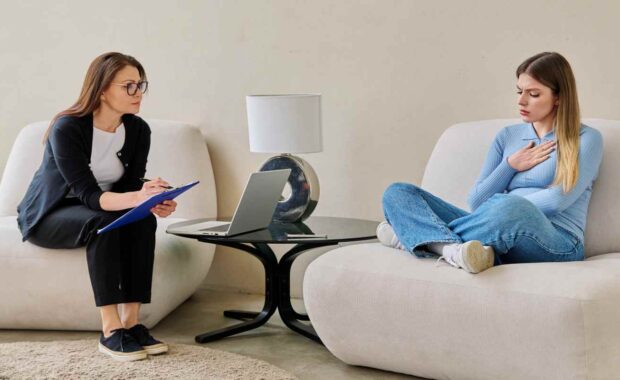 Young Woman in Indivisual Therapy Talking with Professional Therapist