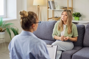 Woman Discussing Her Mental Health with Therapist in Therapy Session