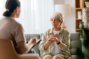 Senior Woman Discussing Her Mental Problems with Psychologist